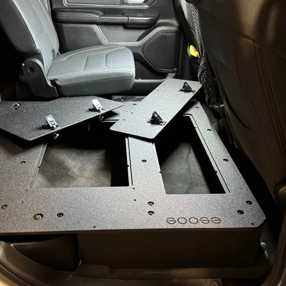 Second-row seat delete platform installed in a truck cab