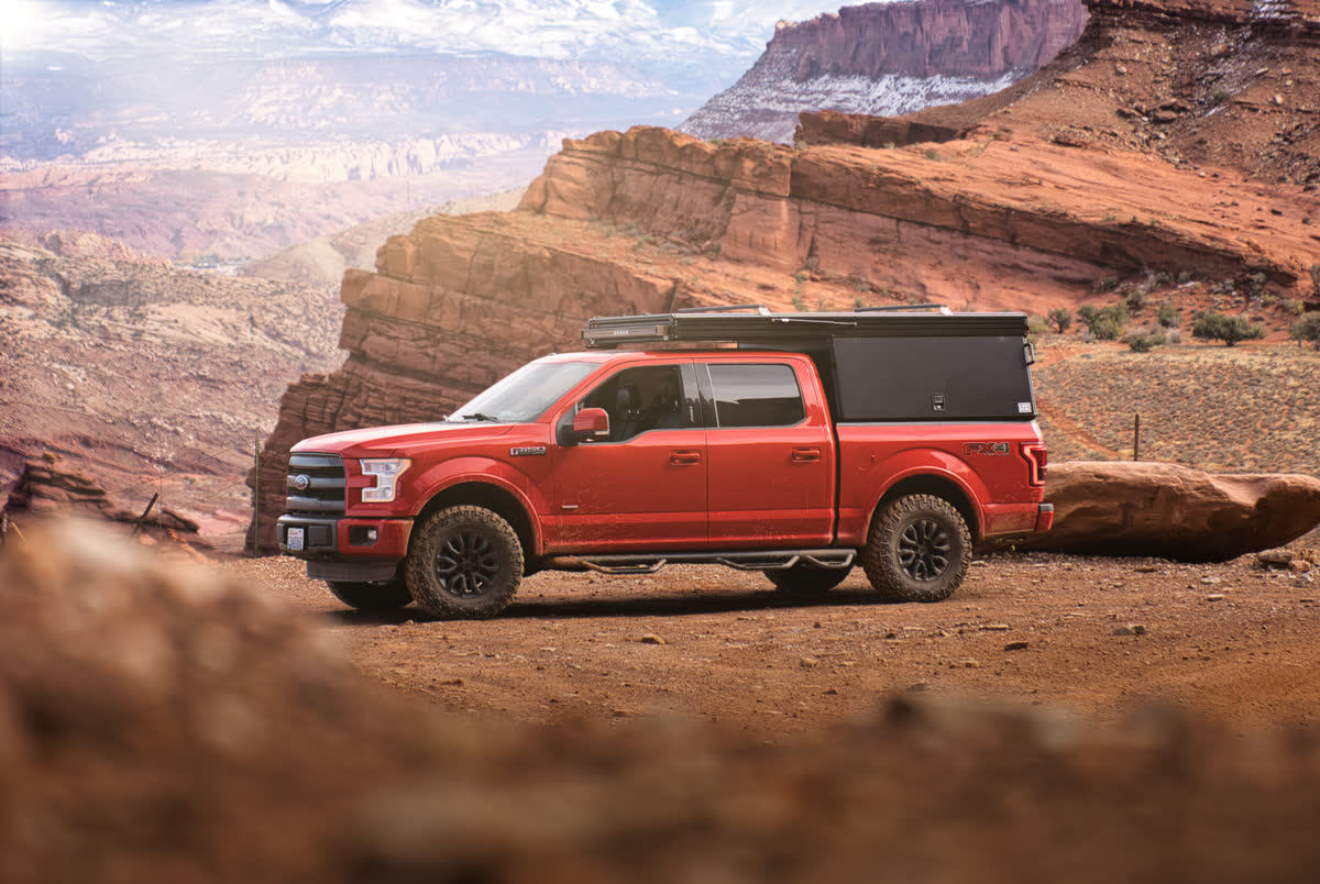 Truck camper parked in the Moab desert