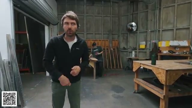 Thomas beside the work area where freshly cut aluminum parts are deburred