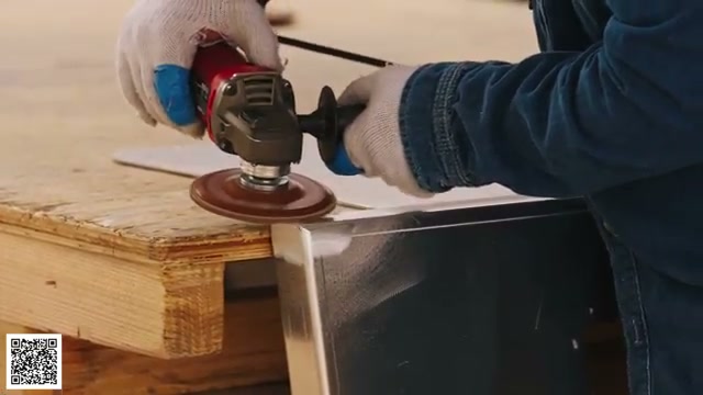 A close view of an aluminum exterior weld being ground and polished