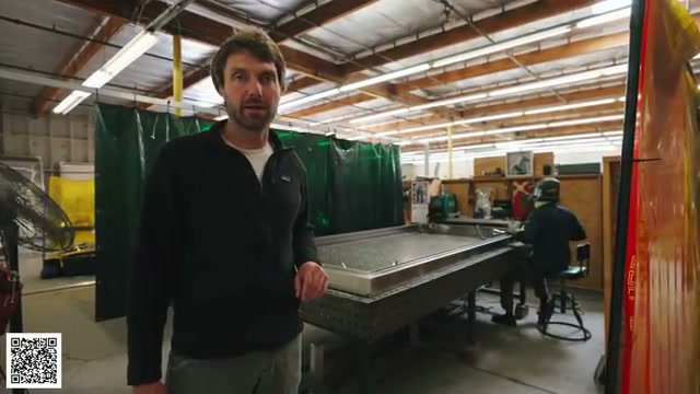 Thomas beside the aluminum welding and fixture area