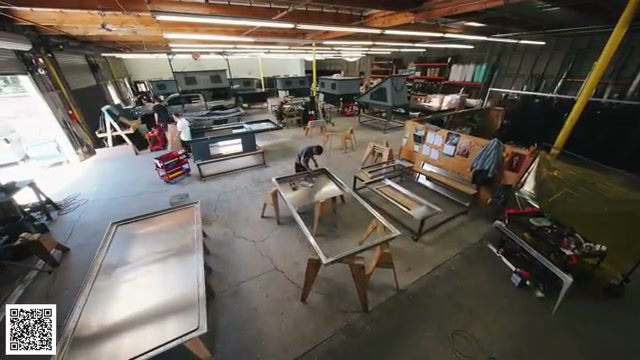 Raw aluminum camper components clamped together in the factory