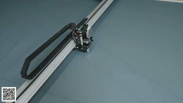 Flexible camper material moving through the cutting plotter