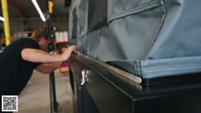 A worker assembling the tent and finished camper shell