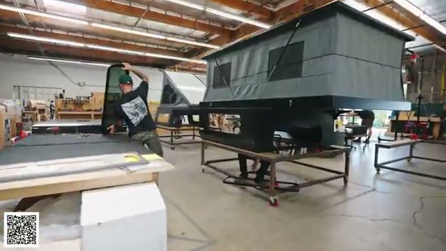 A completed Topo Toppers camper staged inside the factory